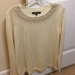 Beautiful cream sweater with gold trim neckline.